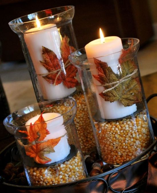 fall decoration with grains, leaves and candles