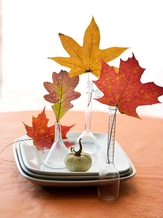 fall decoraiton with leaves in vases